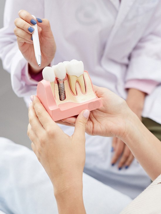State College patient learning about dental implant steps