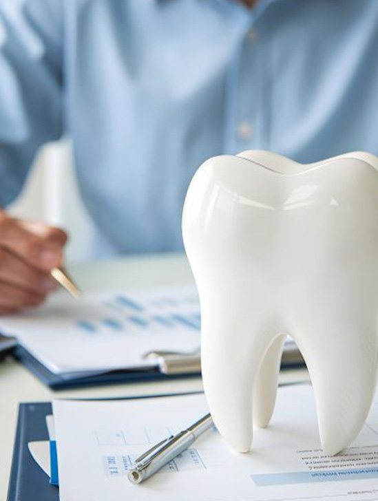 Man budgeting for the cost of dental care