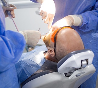 Relaxed State College patient during implant procedure