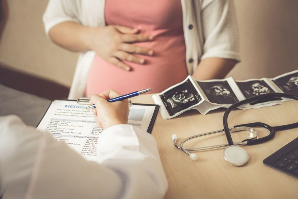 A pregnant woman at a dentist appointment